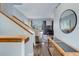 Inviting entryway with wood accents and views of the living space and backyard at 1413 Ben Nevis Ave, Broomfield, CO 80020