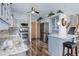 Spacious kitchen featuring granite counters, stainless steel appliances, and a breakfast bar area at 1413 Ben Nevis Ave, Broomfield, CO 80020