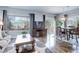 Inviting living space with large windows, a dining area, and comfortable seating at 1413 Ben Nevis Ave, Broomfield, CO 80020