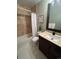 Bathroom with a shower/tub combo, vanity, and decorative mirror at 2510 Concord Cir, Lafayette, CO 80026