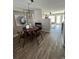 Modern dining area with a round table and four chairs, and a view into the living room at 2510 Concord Cir, Lafayette, CO 80026