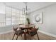 Modern dining area with a round table and four chairs, near a window at 2510 Concord Cir, Lafayette, CO 80026