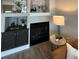 Cozy living room featuring a fireplace and built-in shelving at 2510 Concord Cir, Lafayette, CO 80026