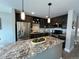 Modern kitchen with dark cabinets and granite countertops at 2510 Concord Cir, Lafayette, CO 80026