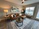 Living room with a brown leather sectional sofa and a large window at 2510 Concord Cir, Lafayette, CO 80026