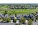 Aerial view of home with lush green community and golf course nearby at 14246 Piney River Rd, Broomfield, CO 80023