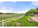 Large manicured backyard features well-maintained lawn and flower beds at 14246 Piney River Rd, Broomfield, CO 80023