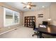 Bedroom with a ceiling fan, large window, and built in bookshelf at 14246 Piney River Rd, Broomfield, CO 80023