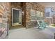 The front entry features a stone exterior, black front door, and sitting area with chairs at 14246 Piney River Rd, Broomfield, CO 80023
