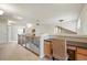 Bright hallway features a built-in desk, decorative railing, and ceiling fan at 14246 Piney River Rd, Broomfield, CO 80023