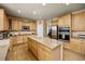 Kitchen boasts an expansive island, lots of storage, and modern stainless steel appliances at 14246 Piney River Rd, Broomfield, CO 80023