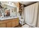 Bathroom with a granite countertop, wooden cabinets, shower, and neutral decor at 4759 Mt Princeton, Brighton, CO 80601