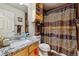 Stylish bathroom with a granite countertop, a white sink, and a decorative shower curtain at 4759 Mt Princeton, Brighton, CO 80601