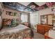 View of the quirky bedroom with a patterned ceiling, stuffed animals and gray walls at 4759 Mt Princeton, Brighton, CO 80601
