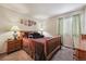 Cozy bedroom featuring neutral walls, carpet, and a view of the yard at 4759 Mt Princeton, Brighton, CO 80601
