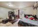 A decorated bedroom featuring a cozy bed, a desk, and a shag rug at 4759 Mt Princeton, Brighton, CO 80601