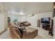 Spacious living room with wall to wall carpet, a large sofa, and a television at 4759 Mt Princeton, Brighton, CO 80601