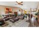 Spacious living room with wood floors, comfortable sofas, and natural light at 4759 Mt Princeton, Brighton, CO 80601