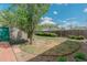 Well-maintained backyard with healthy grass and a beautiful tree at 4480 S Pennsylvania St, Englewood, CO 80113