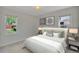 Inviting bedroom features two windows, comfortable bedding and ample natural light, creating a serene atmosphere at 4480 S Pennsylvania St, Englewood, CO 80113