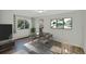 Elegant dining area with a sleek table setting, modern artwork, and lots of natural light at 4480 S Pennsylvania St, Englewood, CO 80113