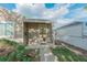 Inviting front porch with a glass front door and manicured landscaping, offering a warm welcome to the home at 4480 S Pennsylvania St, Englewood, CO 80113