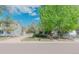 Charming home with well-maintained front yard, lush green lawn, and mature trees, offering great curb appeal at 4480 S Pennsylvania St, Englewood, CO 80113