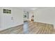 Bright living room features wood-look floors, fresh white paint, and natural light at 4480 S Pennsylvania St, Englewood, CO 80113