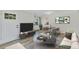 Cozy living room with modern decor, wood flooring, and a comfortable seating area; ideal for relaxation at 4480 S Pennsylvania St, Englewood, CO 80113