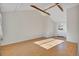 Bright and airy living room featuring light wood floors, exposed beams and large windows at 4480 S Pennsylvania St, Englewood, CO 80113