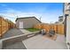 Backyard patio with modern seating and a privacy fence perfect for outdoor relaxation and entertainment at 1423 Xavier St, Denver, CO 80204