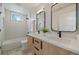Modern bathroom with dual sinks, undermount vanity, tub, shower, and stylish fixtures at 1423 Xavier St, Denver, CO 80204