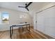 Well-lit bedroom features a ceiling fan, hardwood floors, and a modern minimalist style perfect for an office space at 1423 Xavier St, Denver, CO 80204