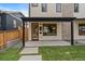 Inviting entrance featuring stylish door with wreath, covered porch, and modern design elements at 1423 Xavier St, Denver, CO 80204