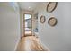 Bright hallway with wood floors, natural light, and decoratively adorned walls at 1423 Xavier St, Denver, CO 80204
