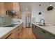 Gourmet kitchen with stainless steel appliances, modern cabinetry, and a stylish island at 1423 Xavier St, Denver, CO 80204