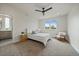 Serene main bedroom with plush carpet, a ceiling fan, and a brightly lit window at 1423 Xavier St, Denver, CO 80204