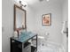Bathroom featuring a vessel sink, toilet, and decorative accents at 1891 Curtis St # 1820, Denver, CO 80202