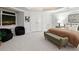 Spacious bedroom with city views, plush bedding, and two armchairs at 1891 Curtis St # 1820, Denver, CO 80202
