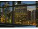Stunning nighttime view of city skyline with lit up buildings at 1891 Curtis St # 1820, Denver, CO 80202