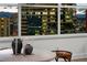 Modern dining area with a stunning city view from the large window at 1891 Curtis St # 1820, Denver, CO 80202