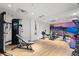 Spacious workout room featuring weight machines, exercise equipment, and a mural at 1891 Curtis St # 1820, Denver, CO 80202