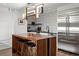 Gourmet kitchen boasts a large island with seating, stainless steel appliances, and stylish light fixture at 1891 Curtis St # 1820, Denver, CO 80202