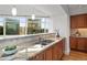 Kitchen sink area with granite countertops, stainless steel sink and hardwood flooring at 1891 Curtis St # 1820, Denver, CO 80202