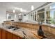 Kitchen sink area with granite countertops and hardwood flooring at 1891 Curtis St # 1820, Denver, CO 80202