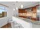Gourmet kitchen boasts stainless steel appliances and breakfast bar at 1891 Curtis St # 1820, Denver, CO 80202