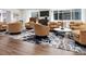Lobby sitting area featuring multiple swivel chairs surrounding a round table and a modern patterned area rug at 1891 Curtis St # 1820, Denver, CO 80202