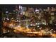 Stunning night view of the city skyline with illuminated buildings and streetlights below at 130 N Pearl St # 1804, Denver, CO 80203
