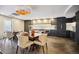 Elegant dining area with a modern chandelier and dining tables at 130 N Pearl St # 1804, Denver, CO 80203