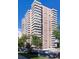 A modern high-rise apartment building with balconies and ample parking at 130 N Pearl St # 1804, Denver, CO 80203